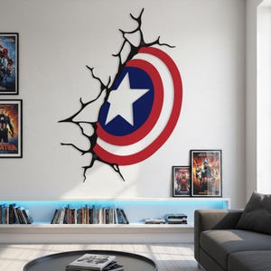 May include: A wall-mounted Captain America shield design in red, white, and blue, with a white star on a blue circle. The shield appears to be breaking through a wall, with black crack-like lines extending outward. The design is a decorative element.