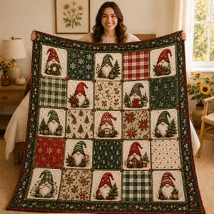 May include: A quilted throw blanket featuring a grid of squares with illustrations of gnomes in various holiday settings, interspersed with patterns of red and green plaid, snowflakes, pine trees, and poinsettias, finished with a dark green border.