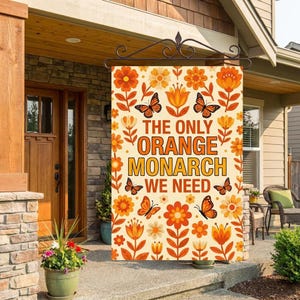 May include: A decorative garden flag with a cream background, featuring orange flowers, butterflies, and the text "THE ONLY ORANGE MONARCH WE NEED." The flag is designed for outdoor use and adds a touch of color to any garden or porch.