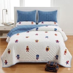 May include: A white quilt and two matching pillow shams featuring a repeating pattern of embroidered Marvel superhero characters. The bedding set includes a blue and white gingham check border and reverse side, with quilted chevron stitching.