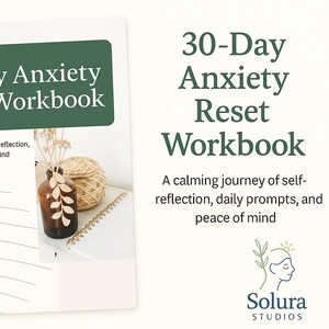 May include: A white spiral-bound workbook with the title "30-Day Anxiety Reset Workbook" in green text. The image includes a brown glass bottle with a leaf design, a ball of twine, and the Solura Studios logo.