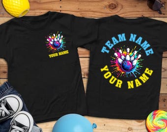 May include: Black t-shirts with bowling-themed graphics. One shirt features a bowling pin design with the text "YOUR NAME". The other shirt has "TEAM NAME" and "YOUR NAME" around a bowling pin design. Accessories include sunglasses, a pineapple, and a lollipop.
