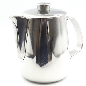 May include: A stainless steel teapot with a lid and handle. The teapot has a shiny, reflective surface and a curved spout. The handle is a simple, curved design. The lid has a small knob on top.