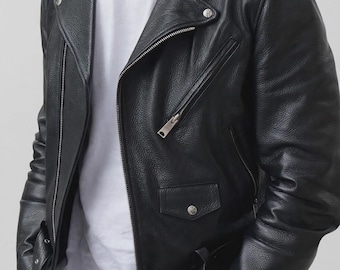May include: A black leather motorcycle jacket featuring a notched lapel, silver-tone metal zippers, a diagonal front zip closure, shoulder epaulets with snap buttons, a chest pocket, and a waist belt with a silver buckle, worn over a white t-shirt.