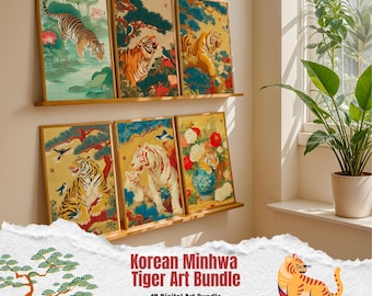 May include: A collection of six framed Korean Minwha tiger art prints. The artwork features tigers in various poses, surrounded by floral and natural elements. The prints are displayed on wooden shelves against a neutral wall.