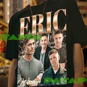May include: A black short-sleeve t-shirt featuring the name ERIC in large gold letters at the top. Below the text is a rectangular graphic print showing four men in a city setting, with the word Winter written in cursive script at the bottom.