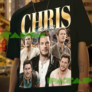 May include: Black t-shirt featuring the name "CHRIS" in gold lettering above a collage of images. The images are of a man in various poses. The shirt is worn by a person.