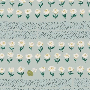 May include: A light blue fabric with a white floral pattern. The flowers are arranged in rows and are interspersed with small blue dots. A ruler is visible at the bottom of the image.
