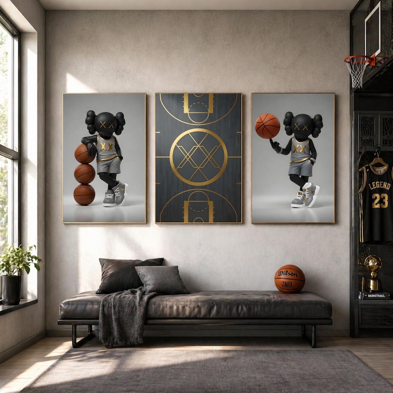 May include: A triptych of framed art featuring a basketball theme. Two panels depict a cartoon figure with basketballs, while the central panel showcases a basketball court design. A basketball sits on a leather bench in front of the artwork.