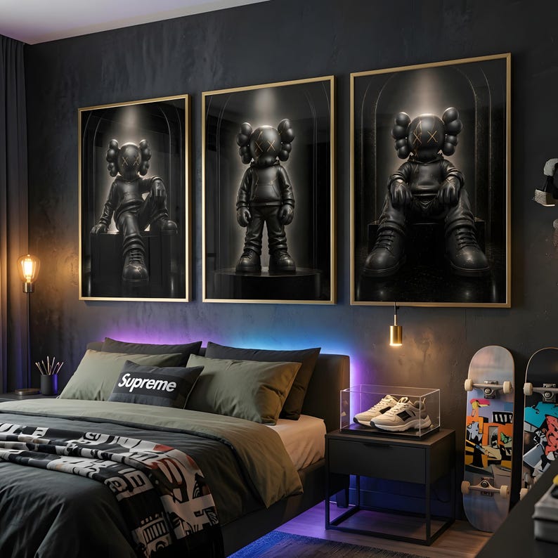 May include: Three framed wall art prints featuring black KAWS-style character figures in a dark, spotlighted setting. The figures are depicted in different poses, including sitting and standing, set against a deep black background with gold frames.