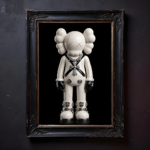 May include: A white vinyl figure with black gloves and boots, a silver chain, and a cross pendant, framed in a black ornate frame. The figure has an "XX" mark for eyes and a cracked design. The background is black.