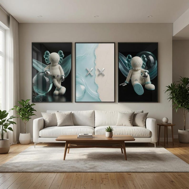 May include: A triptych wall art set featuring two black-framed prints of a white cartoon character with X-shaped eyes and metallic accents, flanking a central print with a light blue liquid wave design and two silver X-shaped symbols.