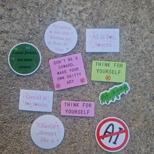 May include: A collection of eleven stickers with various designs and text including I want forests, not data centers, I'd rather see shit human art than AI slop, AI is for losers, DON'T BE A COWARD, MAKE YOUR OWN SHITTY ART, THINK FOR YOURSELF, GenAI is for losers, AI slop, ChatGPT doesn't like u, and a red no AI symbol.