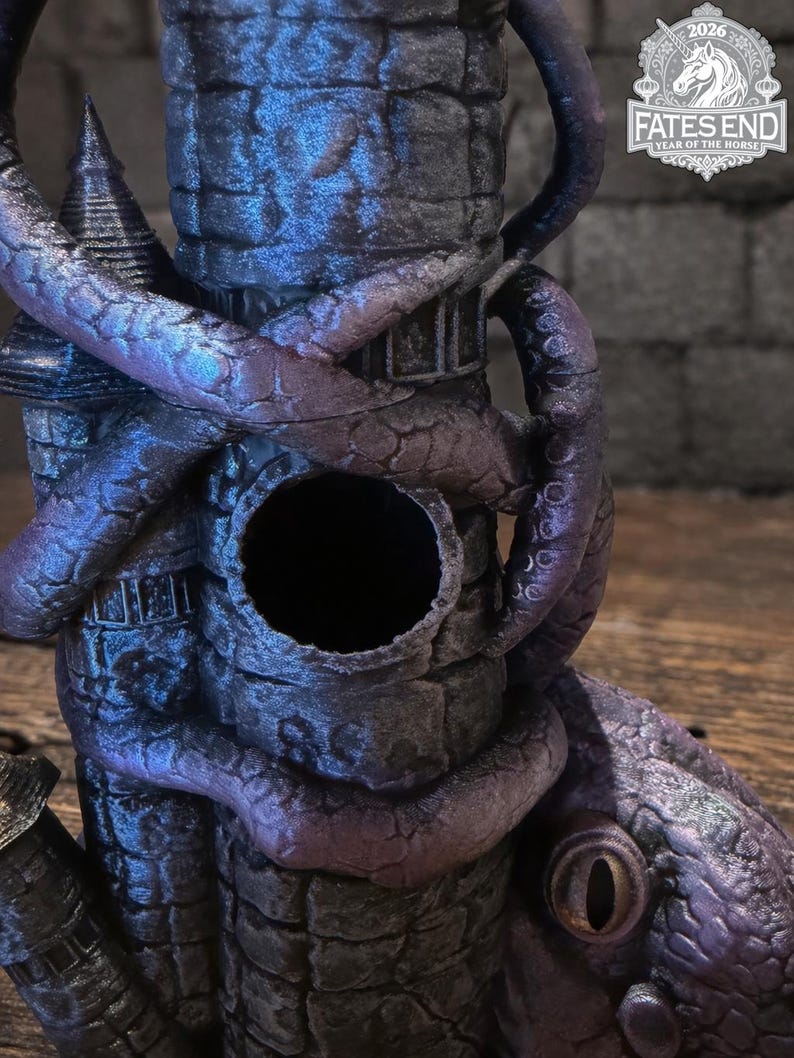 May include: A dark purple and blue stone tower sculpture wrapped in thick, textured tentacles. The structure features a circular opening in the center and a large, reptilian eye at the base. A logo in the corner reads FATES END 2026 YEAR OF THE HORSE.
