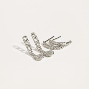 Snake ear jacket earrings in sterling silver, showcasing a polished and elegant design.