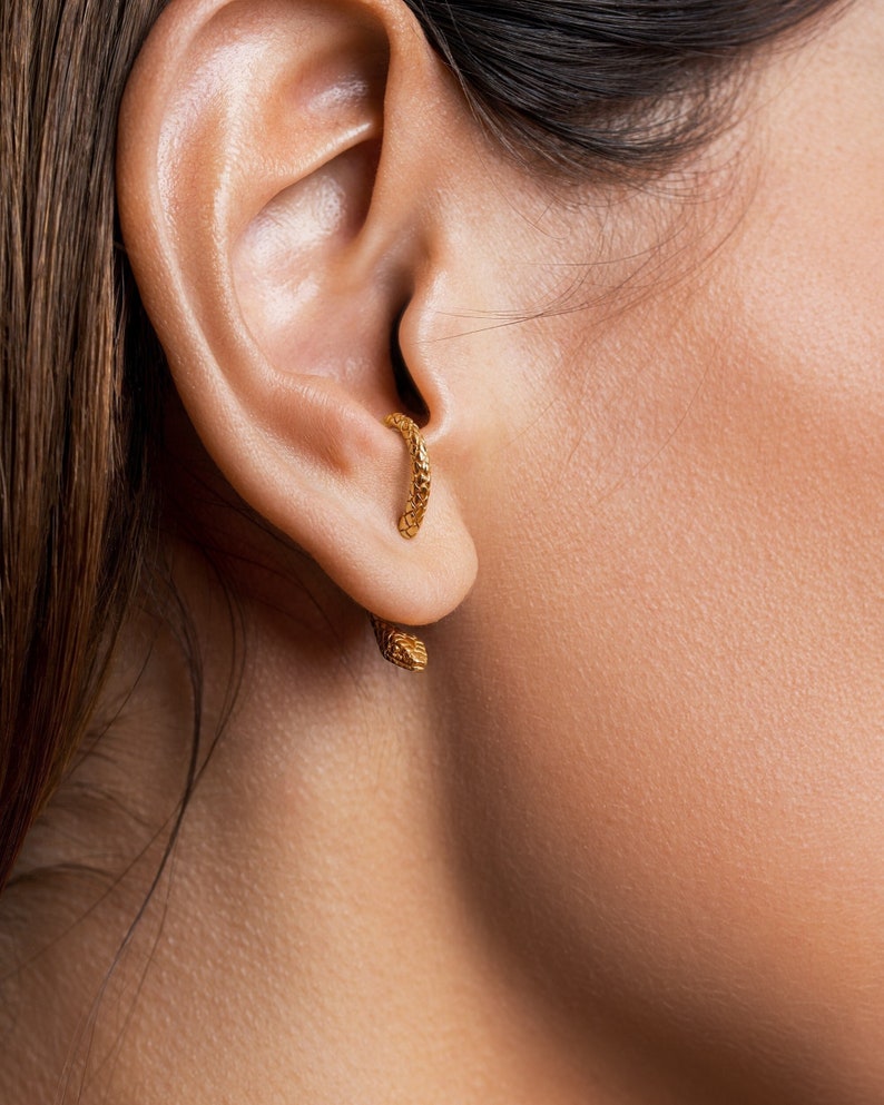 Snake Earrings. Animal Jewelry. Wear it alone for a minimalist look, or stack it with other earrings. 
• Handcrafted in Sterling Silver and polished ﬁnishing, these ear jackets offer three levels to adjust your earlobe