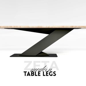 May include: Modern table legs with a light wood top and a black metal base. The design features a unique Z-shaped support structure. The text "ZETA modern TABLE LEGS" is displayed below the table.