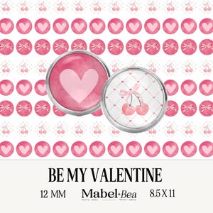 May include: Two 12 mm round glass cabochons with silver settings. One features a pink heart with a white outline. The other features two pink cherries with a white stem and a pink bow on a white and pink checkered background. The text "BE MY VALENTINE" is below the cabochons. The text "12 MM" is below the left cabochon. The text "Mabel+Bea" is below the right cabochon. The text "8.5 X 11" is below the text "Mabel+Bea".