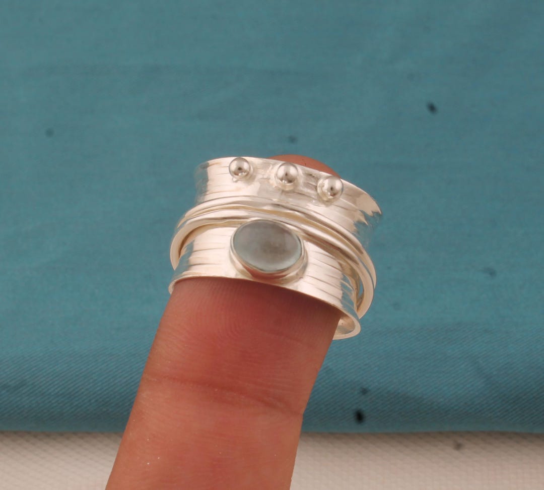 we took our beloved hand hammered band and made it... Aquamarine Silver Plated Spinner Ring: Hand Hammered Band, Handmade - Etsy