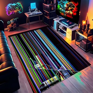 May include: A rectangular black rug with a vibrant, colorful design of vertical lines in shades of red, green, blue, and yellow. The rug is placed in a gaming room setting, with a sofa and gaming equipment visible in the background.