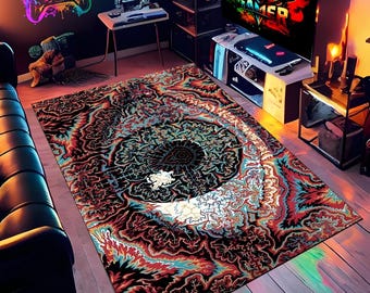 May include: A rectangular area rug with a vibrant, psychedelic design in shades of red, blue, black, and white. The rug features a central circular pattern with intricate details, suitable for a gaming room or entertainment space.