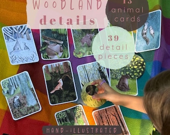 May include: A set of 13 rectangular woodland animal cards and 39 circular detail pieces featuring hand-illustrated forest scenes. The cards display various animals including a fox, badger, and bear in natural habitats with trees and foliage.