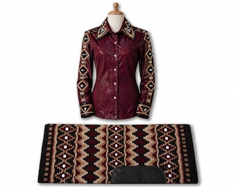 May include: A deep burgundy long-sleeve button-down shirt featuring a pointed collar and sleeves adorned with black and gold geometric diamond-shaped embellishments. Below, a rectangular saddle pad displays a repeating geometric pattern in black, tan, and burgundy with a black leather patch.