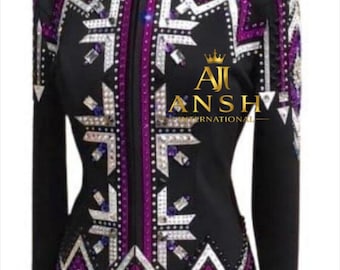 May include: A black long-sleeve jacket featuring a high collar and a full-length front zipper. The garment is decorated with geometric patterns in purple and white, accented with numerous clear and purple crystals. The text AJI ANSH INTERNATIONAL is visible.