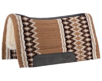 May include: A rectangular horse saddle pad featuring a woven pattern in shades of tan, dark brown, and cream. The pad includes a thick, off-white fleece lining on the underside and dark brown leather-like reinforcement patches along the spine and sides.