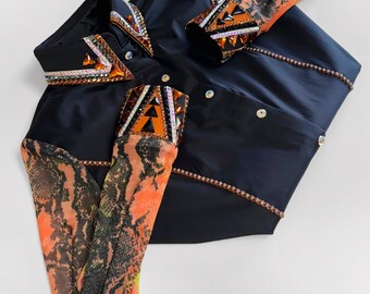 May include: A navy blue shirt with orange and black patterned sleeves and accents. The shirt features decorative beading and jewel embellishments on the collar, cuffs, and front. The sleeves have a snakeskin-like pattern.