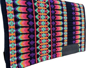 May include: A rectangular black saddle pad with a vibrant, geometric pattern. The design features vertical stripes of orange, pink, green, and purple against a black background. A black leather patch is on the bottom right corner.