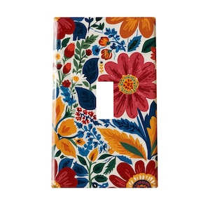 May include: A decorative light switch cover featuring a vibrant floral pattern. The design includes large red, orange, and yellow flowers, with blue and green foliage against a cream background. The cover has a single switch opening.