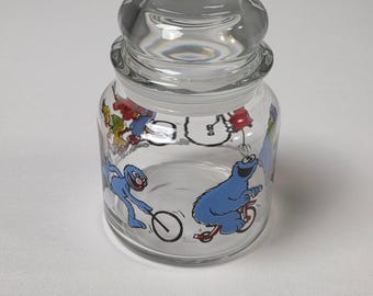 Tarro de cristal vintage para caramelos de Barrio Sésamo de Anchor Hocking: Bert, Ernie, Oscar y Big Bird.