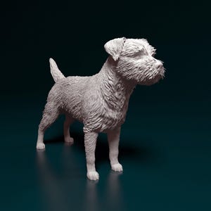 May include: A detailed, off-white sculpture of a dog in a standing pose. The dog has a textured, shaggy coat, with visible fur details. The sculpture is set against a dark teal background, highlighting the dog's form.