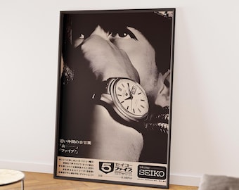 May include: Black and white framed poster featuring a close-up of a person's face with a wristwatch. The watch has a white face with black hands and markers. Japanese text and the Seiko logo are visible at the bottom.