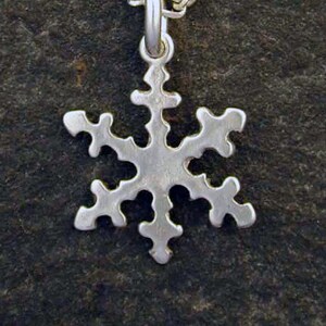 Sterling Silver Snow Flake Pendant on Sterling Silver Chain.