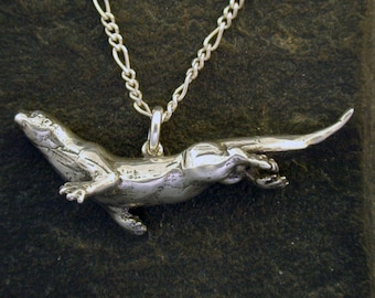 Sterling Silver Swimming Otter Pendant on a Sterling Silver Chain.