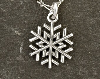 Sterling Silver Snow Flake Pendant on Sterling Silver Chain.