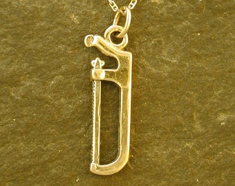 14K Gold Hack Saw Pendant on a 14K Gold Chain