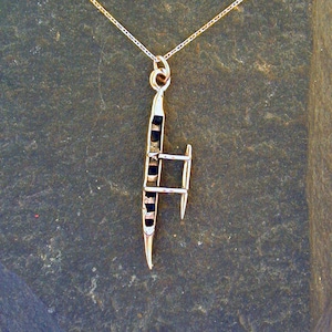 14K Gold Hawaian Outrigger Canoe Pendant on a 14K Gold Chain.