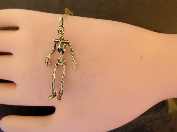 Gold skeleton pendant clearance