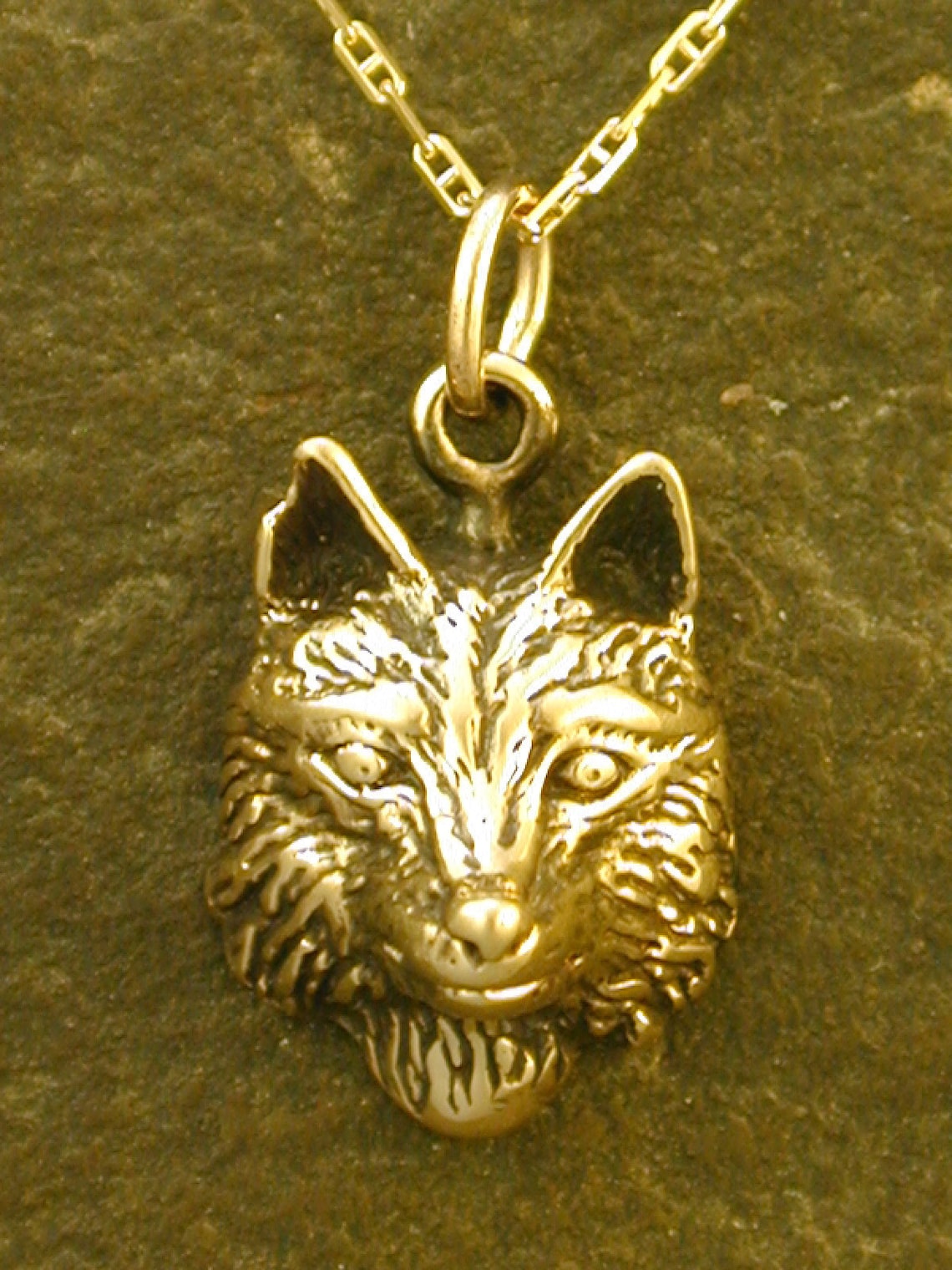 solid gold wolf pendant