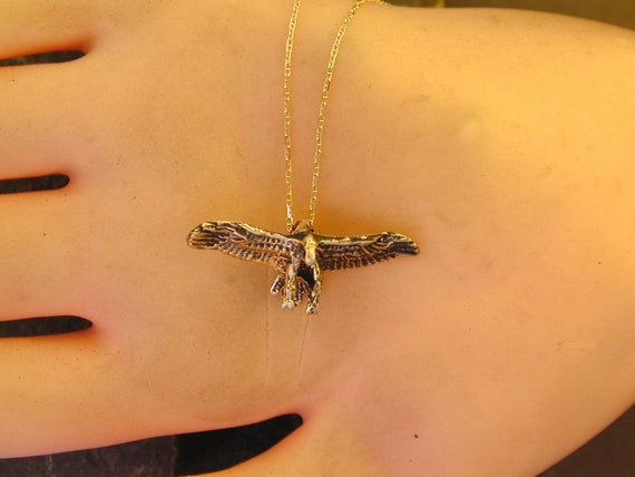 Gold 2024 hawk pendant