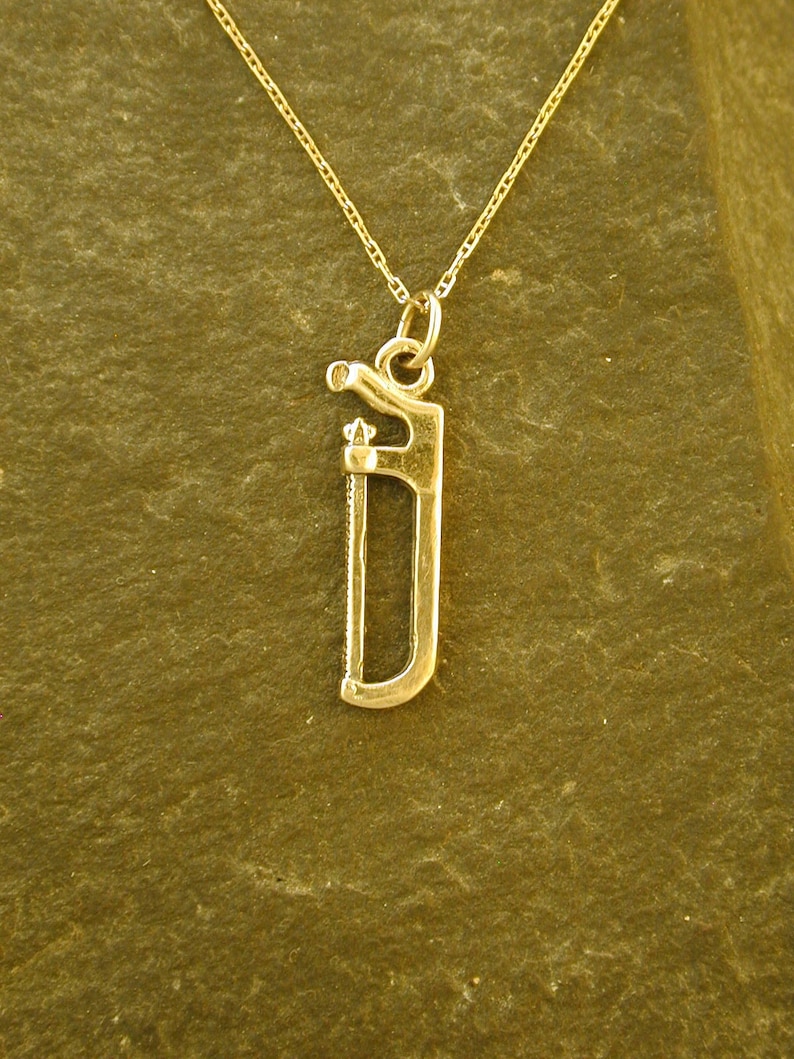 14K Gold Hack Saw Pendant on a 14K Gold Chain image 1