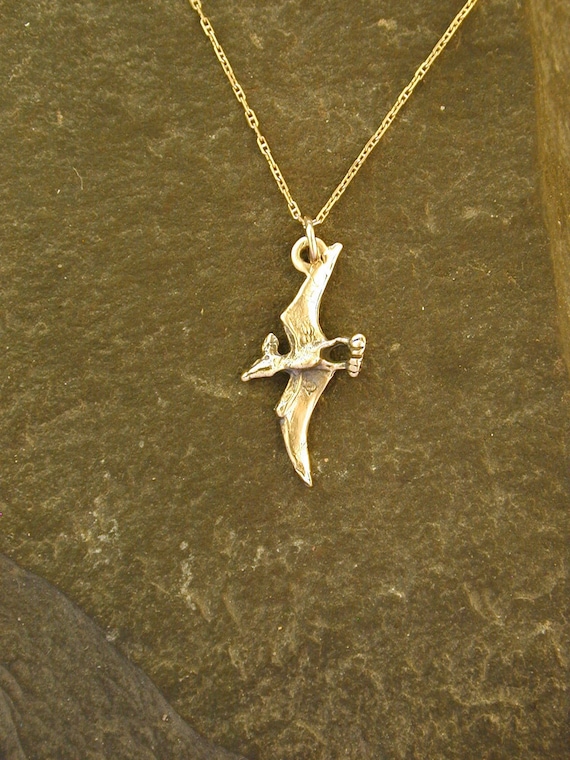 Gold deals dinosaur pendant