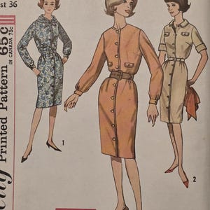 May include: A vintage sewing pattern envelope featuring illustrations of three dresses with button-front closures, long sleeves, and belted waists. The text includes 681, Bulah Perkins 1963, and SIMPLE TO MAKE. The dresses are shown in blue floral, solid peach, and solid beige.