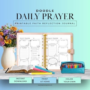 May include: A printable faith reflection journal with the text "DOODLE DAILY PRAYER." The journal is open, revealing lined pages with doodle-style prompts. Colored pencils and an open book are next to the journal. A vase of flowers and a pencil case are also in the image.