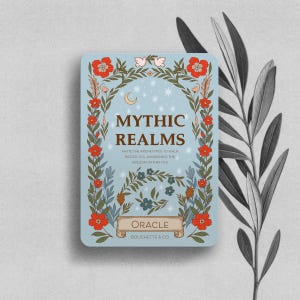 May include: A rectangular card with a light blue background featuring a floral border of red flowers and green leaves. The text reads MYTHIC REALMS, INVITE THE ARCHETYPES TO WALK BESIDE YOU, AWAKENING THE WISDOM WITHIN YOU, ORACLE, and BOUCHETTE & CO.