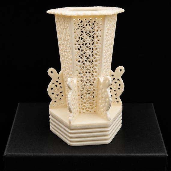 Intricately hand-carved from ethically sourced buffalo bone, this desk organizer is a sculptural artifact that doubles as a pen holder — zero mass-production vibes.