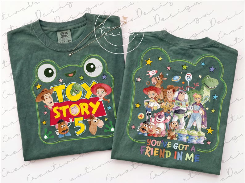 May include: Two dark green t-shirts featuring Toy Story graphics. The left shirt displays a frog-shaped frame with the text Toy Story 5 and character faces. The right shirt shows a group of Toy Story characters and the text You've Got A Friend In Me.